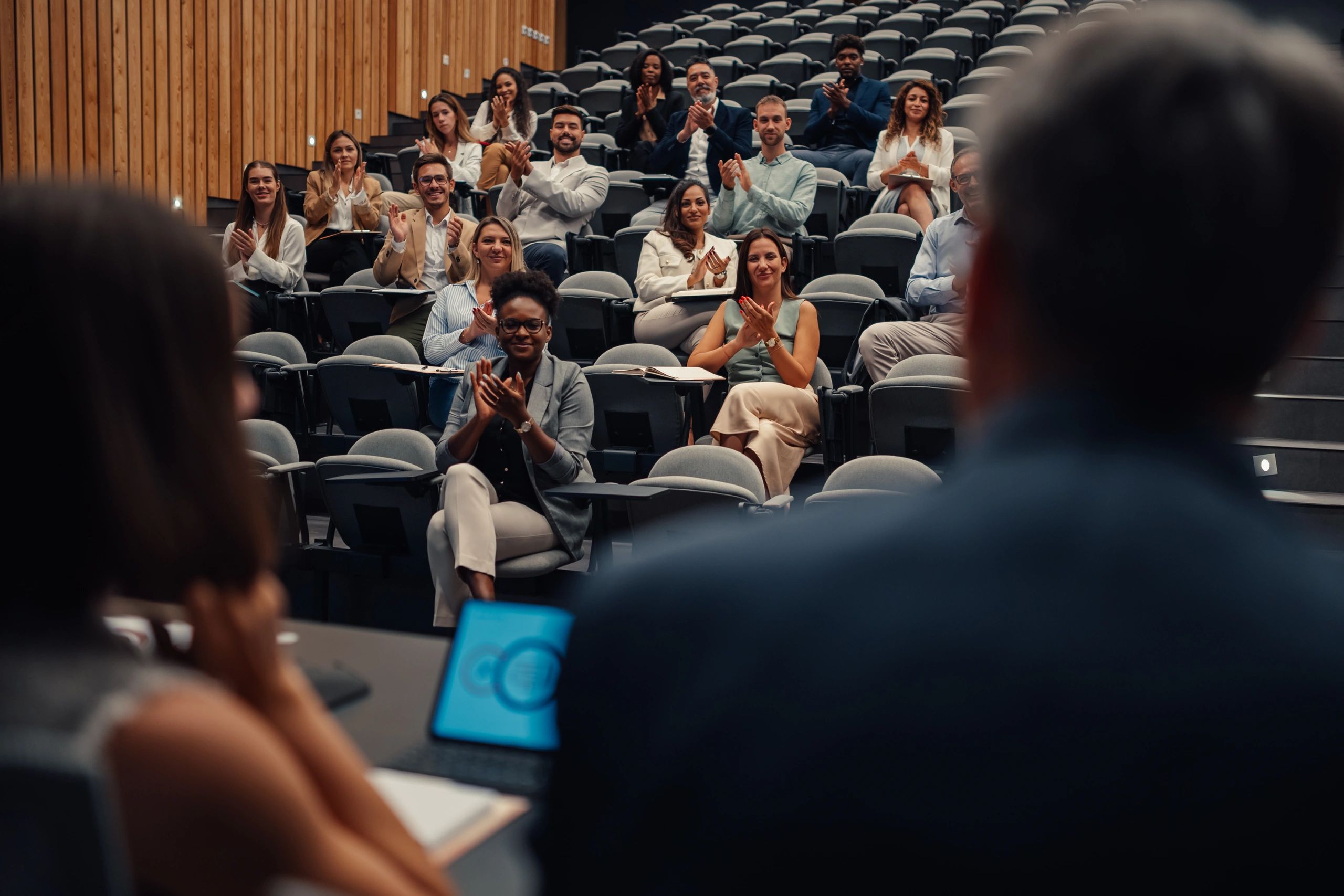 Audience attending a seminar in a modern lecture hall