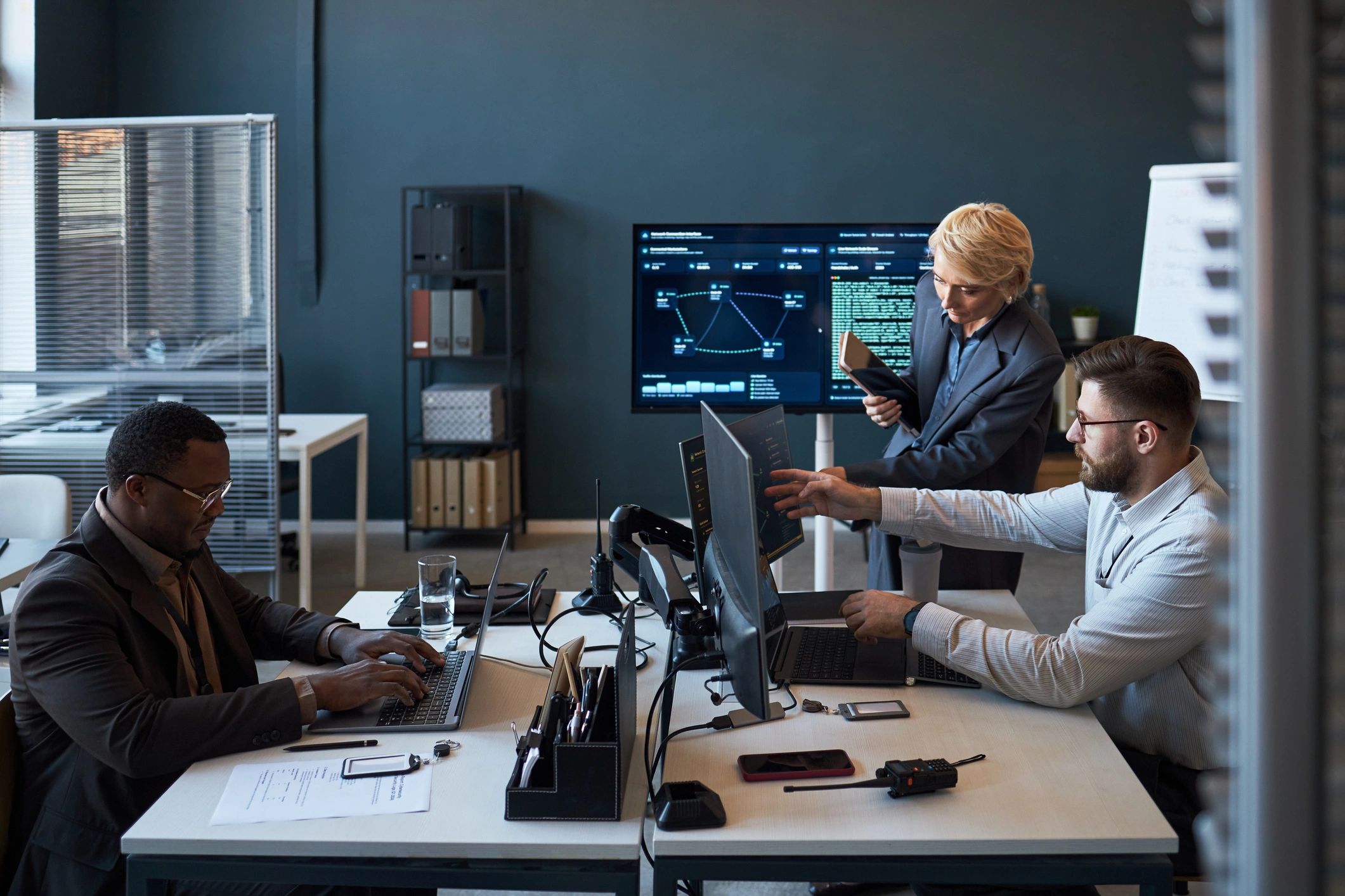 Research team reviewing digital infrastructure information